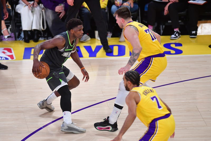Minnesota Timberwolves forward Julius Randle (30) controls the ball against Los Angeles Lakers guard Luka Doncic (77) during the second half in game five of first round for the 2025 NBA Playoffs at Crypto.com Arena.