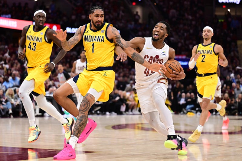 May 4, 2025; Cleveland, Ohio, USA; Cleveland Cavaliers guard Donovan Mitchell (45) drives to the basket against Indiana Pacers forward Obi Toppin (1) during the second half in game one of the second round for the 2025 NBA Playoffs at Rocket Arena.