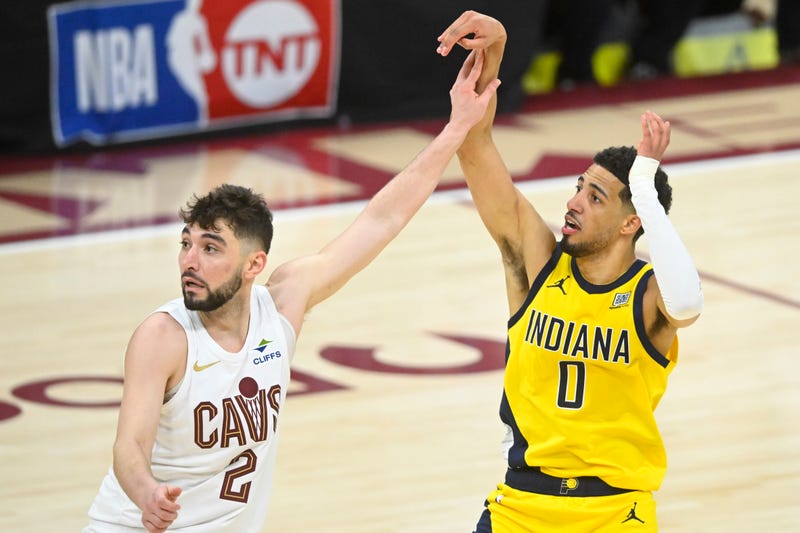 Cleveland Cavaliers guard Ty Jerome (2) defends Indiana Pacers guard Tyrese Haliburton (0) on a follow through for a game-winning three-point basket in the fourth quarter during game two of the second round of the 2025 NBA Playoffs at Rocket Arena. 