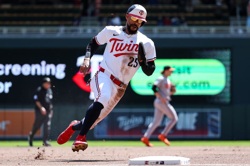 Minnesota Twins center fielder Byron Buxton (25) rounds third base to score on a single hit by first baseman Ty France (13) during the first inning against the Baltimore Orioles at Target Field.
