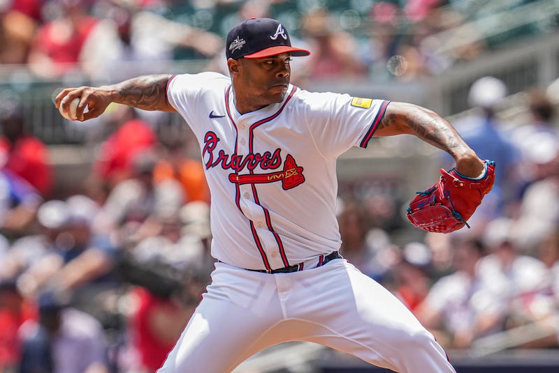 Atlanta Braves pitcher Raisel Iglesias (26) pitches against the Washington Nationals during the ninth inning at Truist Park