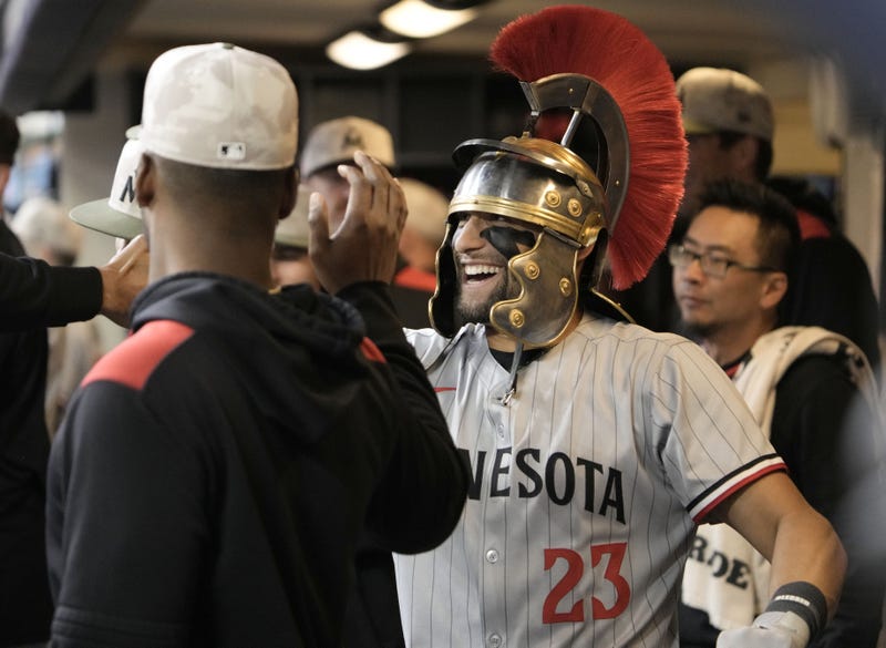 Minnesota Twins third base Royce Lewis (23) celebrates in the dugout after hitting a home run against the Milwaukee Brewers in the fourth inning at American Family Field.