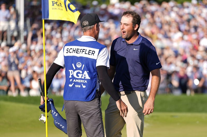 Scottie Scheffler celebrating PGA Championship with caddie