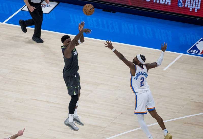 Timberwolves guard Anthony Edwards (5) shoots against Oklahoma City Thunder guard Shai Gilgeous-Alexander (2) in the fourth quarter during game one of the western conference finals for the 2025 NBA Playoffs at Paycom Center. 