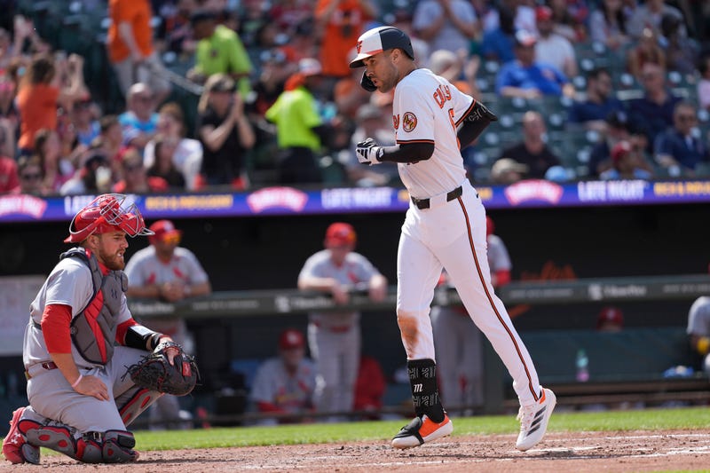 Baltimore Orioles center fielder Dylan Carlson (15) crosses home plate after hitting a three run home run against the St. Louis Cardinals during the fourth inning at Oriole Park at Camden Yards.