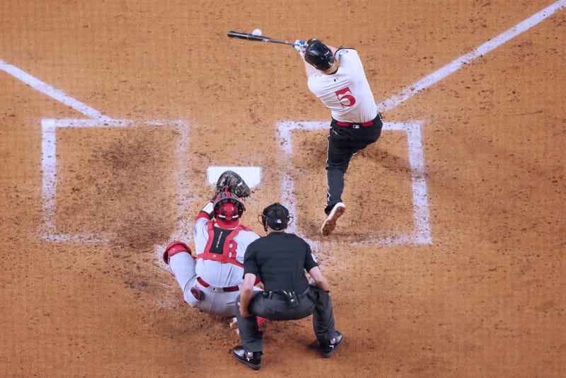 Texas Rangers shortstop Corey Seager (5) singles during the fourth inning against the St. Louis Cardinals at Globe Life Field.