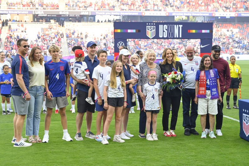 Former United States defender Becky Sauerbrunn with friends and family pose for a photo during a pre-game ceremony celebrating Sauerbrunns retirement prior to a match against Jamaica at Energizer Park.