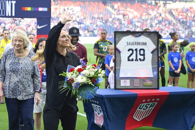 Former United States defender Becky Sauerbrunn acknowledges fans during a pre-match ceremony celebrating her retirement prior to a match against Jamaica at Energizer Park.