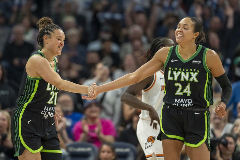 Minnesota Lynx guard Kayla McBride (21) celebrates with Minnesota Lynx forward Napheesa Collier (24) after making a shot against the Phoenix Mercury in the second half at Target Center.
