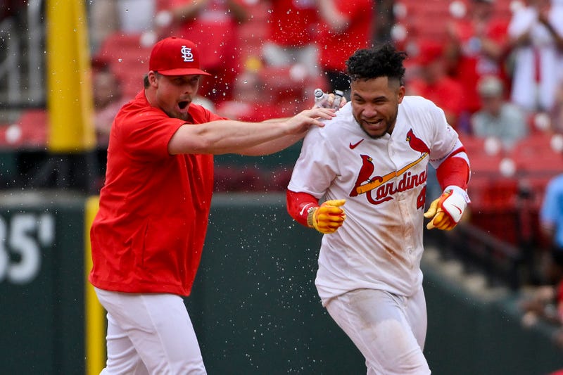St. Louis Cardinals first baseman Willson Contreras (40) reacts as he is mobbed by Nolan Gorman (16) after hitting a walk-off one run single against the Kansas City Royals during the tenth inning at Busch Stadium.