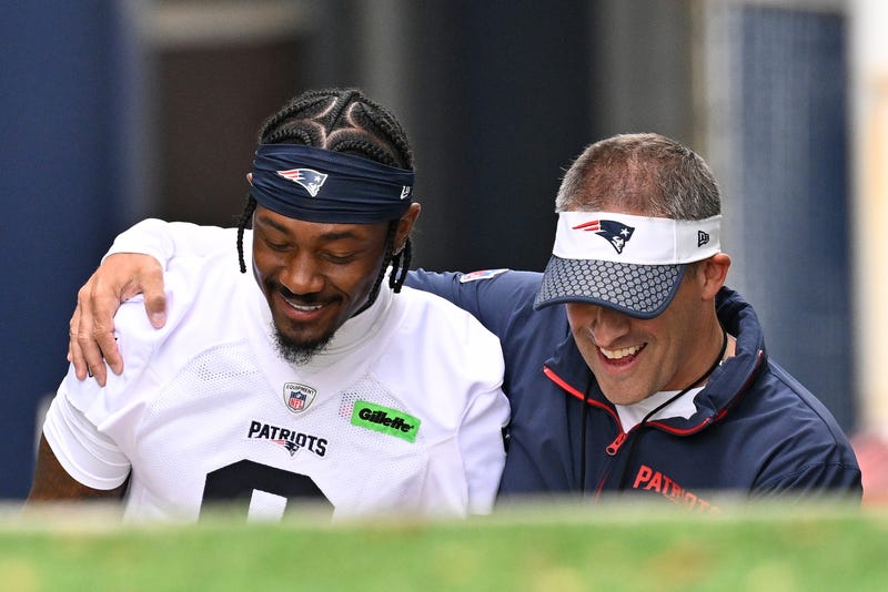 Foxborough, MA, USA; New England Patriots offensive coordinator Josh McDaniels (r) walks to the practice field with his arm around wide receiver Stefon Diggs (8) before minicamp at Gillette Stadium.