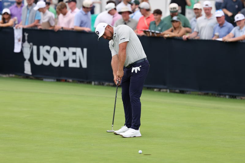 Bryson DeChambeau putts on the practice green during a practice round for the U.S. Open golf tournament at Oakmont Country Club.