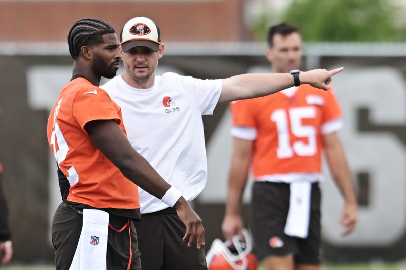 Jun 10, 2025; Berea, OH, USA; Cleveland Browns quarterback Shedeur Sanders (12) talks to Cleveland Browns offensive coordinator Tommy Rees during minicamp at CrossCountry Mortgage Campus. Mandatory Credit: Ken Blaze-Imagn Images