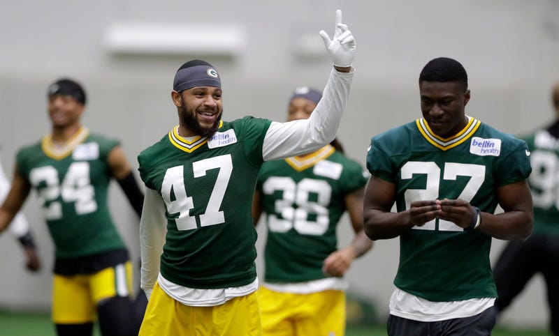 Green Bay Packers cornerback Isaiah Dunn (47) stretches during the team's first day of minicamp on June 10, 2025, at Ray Nitschke Field in Ashwaubenon, Wis.