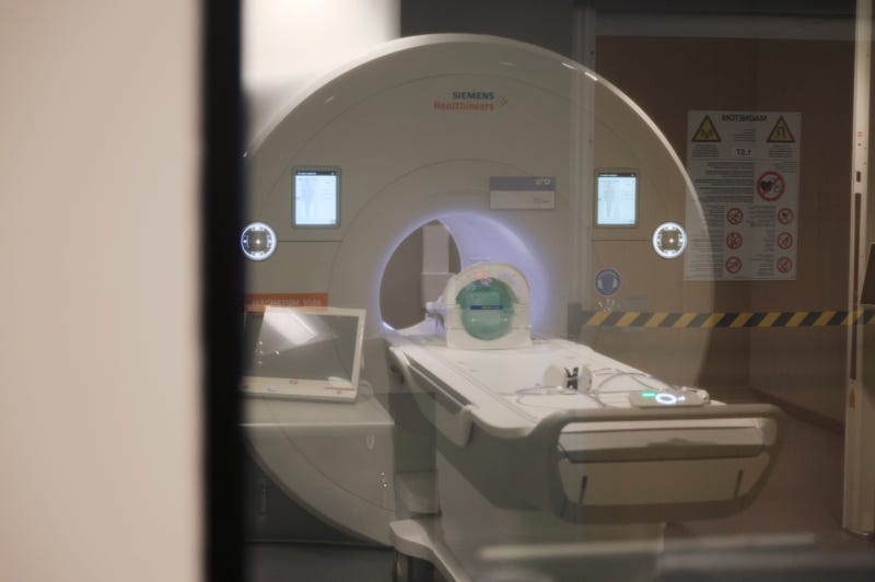 A man wearing a "large chain" died after he was sucked into an MRI machine in Westbury on Wednesday.