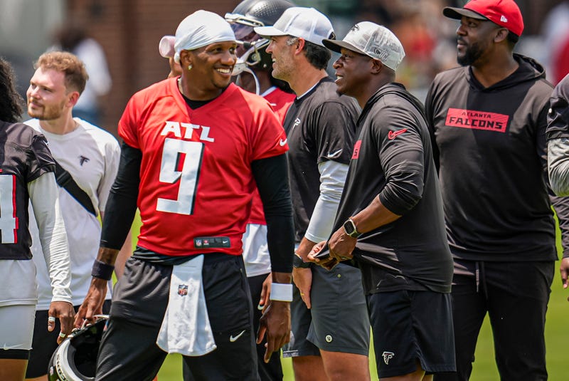 Jun 11, 2025; Atlanta, GA, USA; Atlanta Falcons quarterback Michael Penix Jr. (9) and head coach Raheem Morris on the field during Minicamp at Children's Healthcare of Atlanta Training Ground. Mandatory Credit: Dale Zanine-Imagn Images