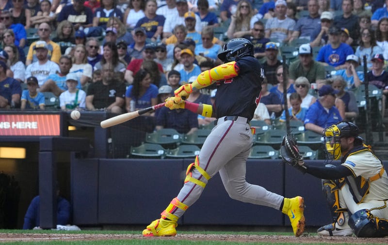 Atlanta Braves outfielder Ronald Acuna Jr. (13) singles against the Milwaukee Brewers in the eighth inning at American Family Field.