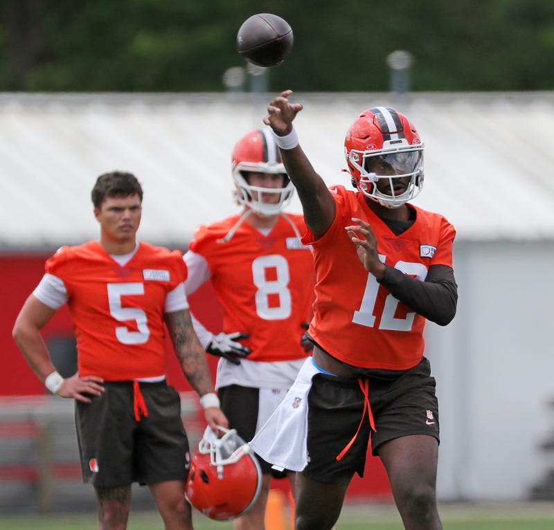 Browns quarterback Shedeur Sanders throws as QBs Dillon Gabriel (5) and Kenny Pickett look on during minicamp, Tuesday, June 10, 2025, in Berea.