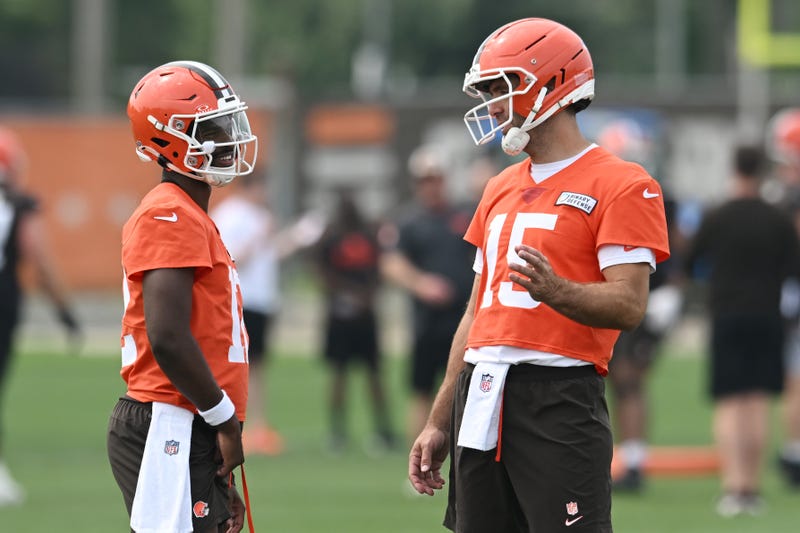 Jun 12, 2025; Berea, OH, USA; Cleveland Browns quarterback Joe Flacco (15) talks to quarterback Shedeur Sanders (12) during mini camp at CrossCountry Mortgage Campus.