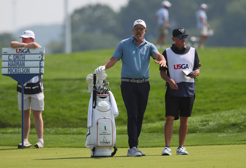 Phil Mickelson talks to his caddie during the 125TH US Open at Oakmont Country Club in Oakmont, PA on June 12, 2025.