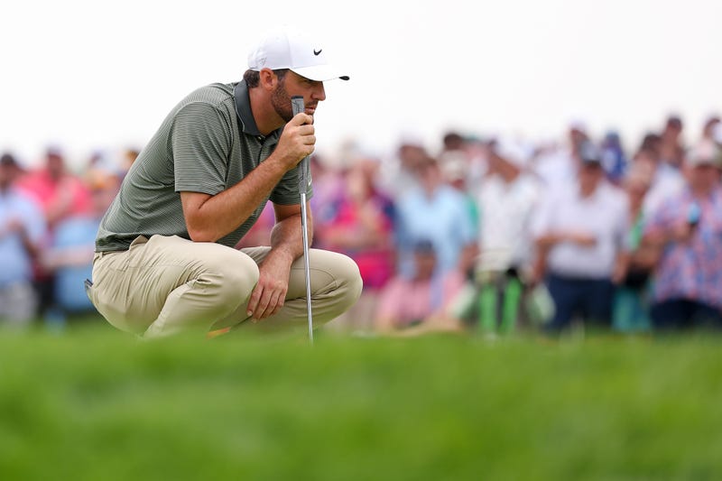 Scottie Scheffler looks at a putt at the US Open