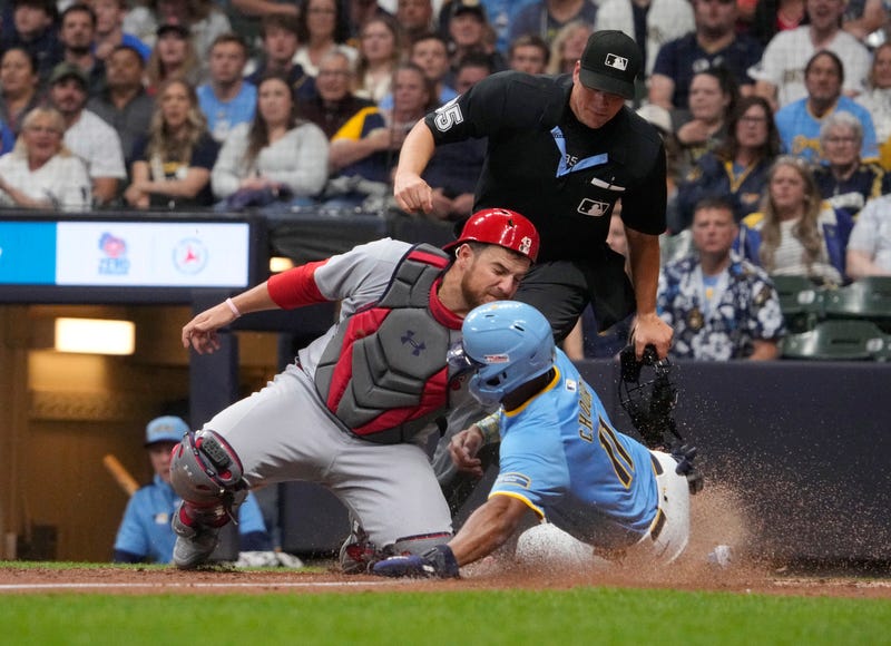 Milwaukee Brewers outfielder Jackson Chourio (11) slides safely into home plate against St. Louis Cardinals catcher Pedro Pages (43) in the sixth inning at American Family Field.