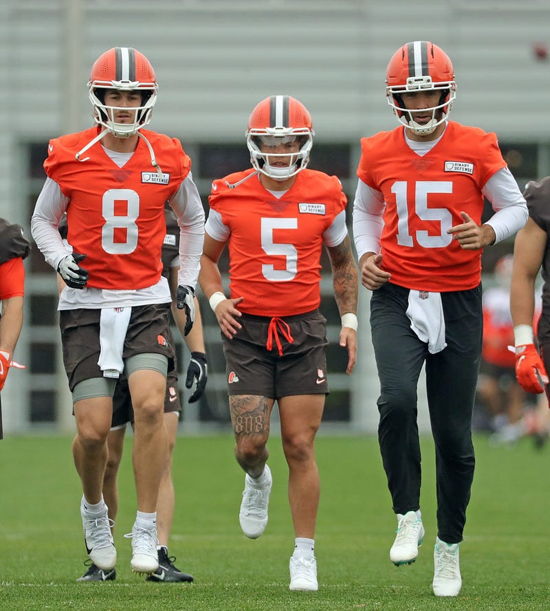Cleveland Browns quarterbacks Kenny Pickett, left, Dillon Gabriel, center, and Joe Flacco warm up during an practice at the Browns training facility May 28, 2025, in Berea, Ohio.