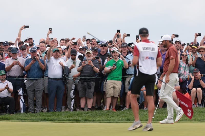 Scottie Scheffler with crowd cheering at US Open