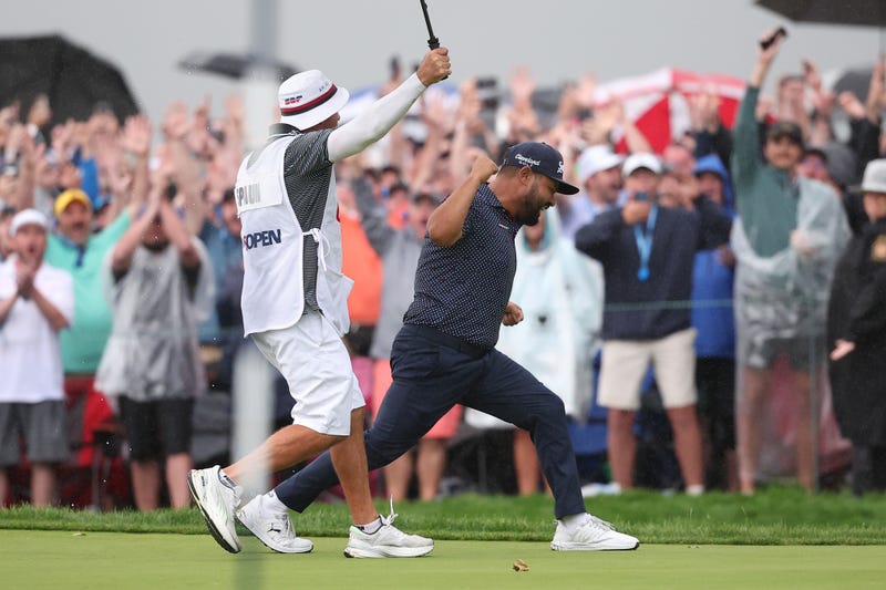JJ Spaun celebrates after making putt on 18