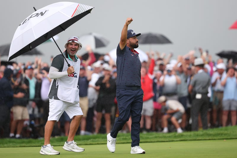 JJ Spaun celebrates after putting on the 18th green to win during the final round of the U.S. Open golf tournament.