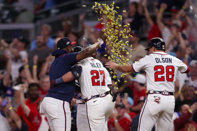Atlanta Braves third baseman Austin Riley (27) celebrates with teammates after a walk-off sacrifice fly against the New York Mets