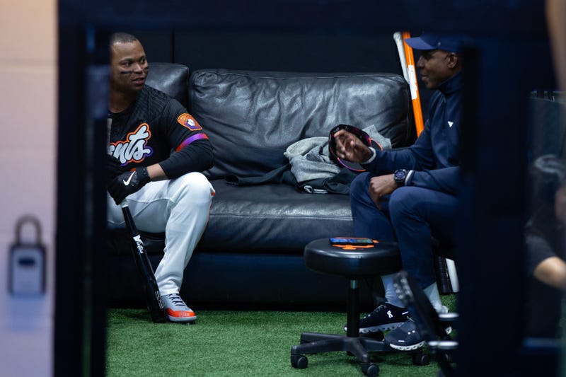 Newly acquired San Francisco Giants designated hitter Rafael Devers (16) chats with former Giants star Barry Bonds before his first game with his new team against the Cleveland Guardians at Oracle Park.