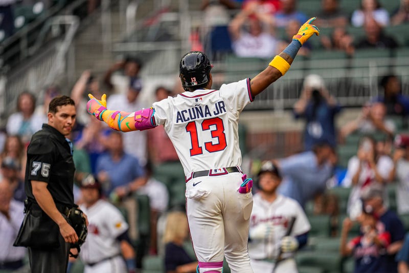 Atlanta Braves right fielder Ronald Acuna Jr (13) reacts after hitting a lead off home run against the New York Mets during the first inning at Truist Park.