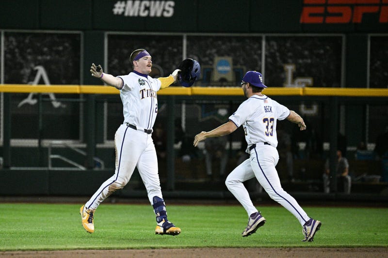 LSU Tigers first baseman Jared Jones (22) celebrates with Dalton Beck (33)