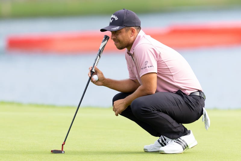 Xander Schauffele prepares to putt on the 17th hole during the first round of the Travelers Championship golf tournament.
