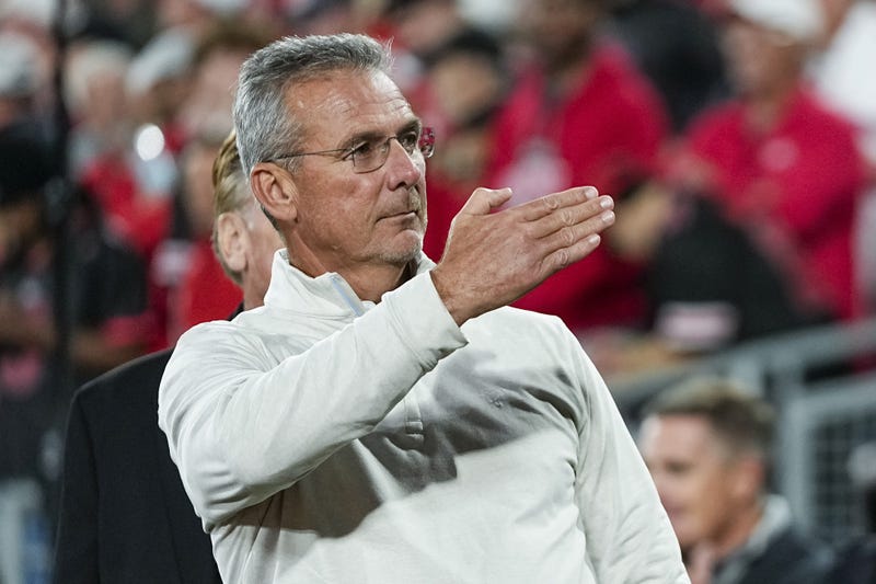 Former Ohio State Buckeyes head coach Urban Meyer salutes the fans chanting his name during the College Football Playoff quarterfinal against the Oregon Ducks at the Rose Bowl in Pasadena, Calif. on Jan. 1, 2025. Ohio State won 41-21