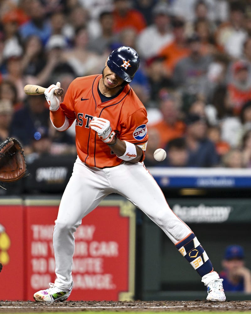 Houston Astros shortstop Jeremy Pena (3) hit by a pitch in the second inning against the Chicago Cubs at Daikin Park.