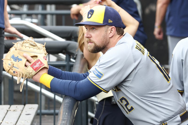 Jul 2, 2025; New York City, New York, USA; Milwaukee Brewers first baseman Rhys Hoskins (12) watches from the dugout prior to game against the New York Mets at Citi Field. Mandatory Credit: Wendell Cruz-Imagn Images