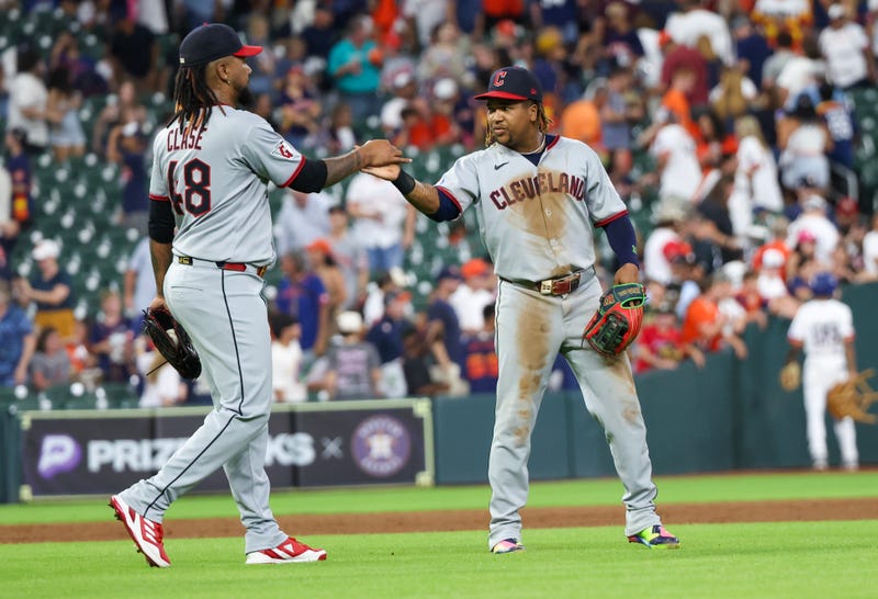 Cleveland Guardians relief pitcher Emmanuel Clase (48) celebrates with third baseman Jose Ramirez (11) after defeating the Houston Astros at Daikin Park