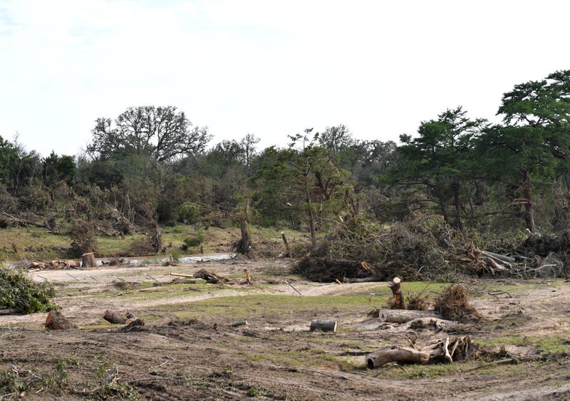 Several trees are cut down inside the Guadalupe Keys RV Resort, in Center Point, Texas on July 7, 2025 after catastrophic flooding of the Guadalupe River last week.