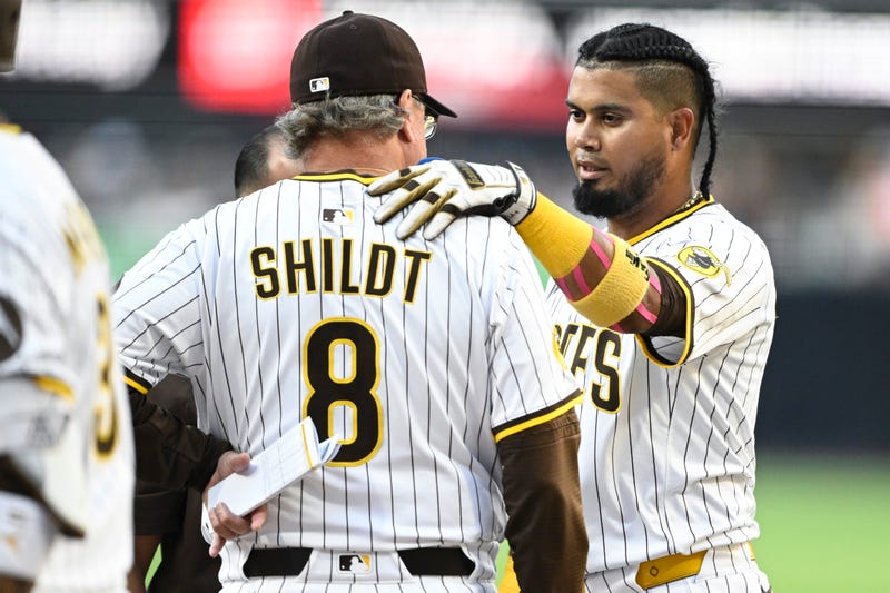 San Diego Padres first baseman Luis Arraez (4) talks with manager Mike Shildt (8) after fouling a ball off during the first inning against the Arizona Diamondbacks at Petco Park