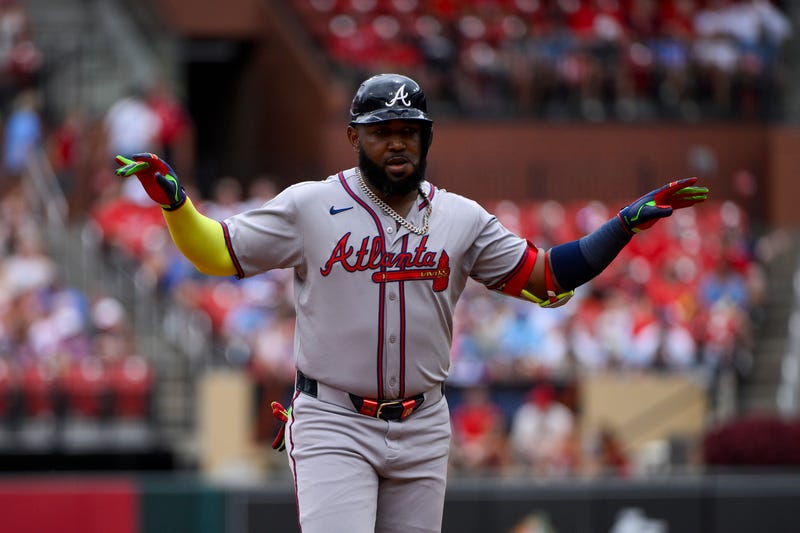 Atlanta Braves designated hitter Marcell Ozuna (20) reacts as he runs the bases after hitting a solo home run against the St. Louis Cardinals during the second inning at Busch Stadium.