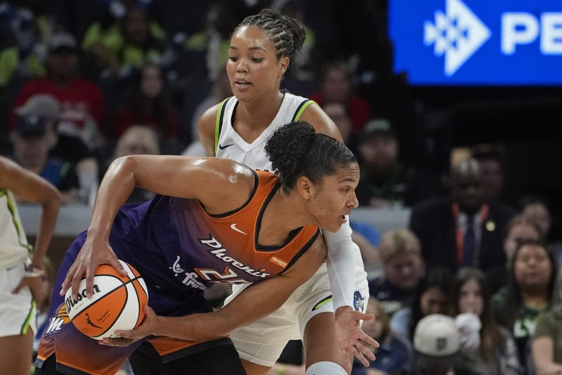 Lynx forward Napheesa Collier (24) defends against Phoenix Mercury forward Alyssa Thomas (25) in the first quarter at Target Center. 
