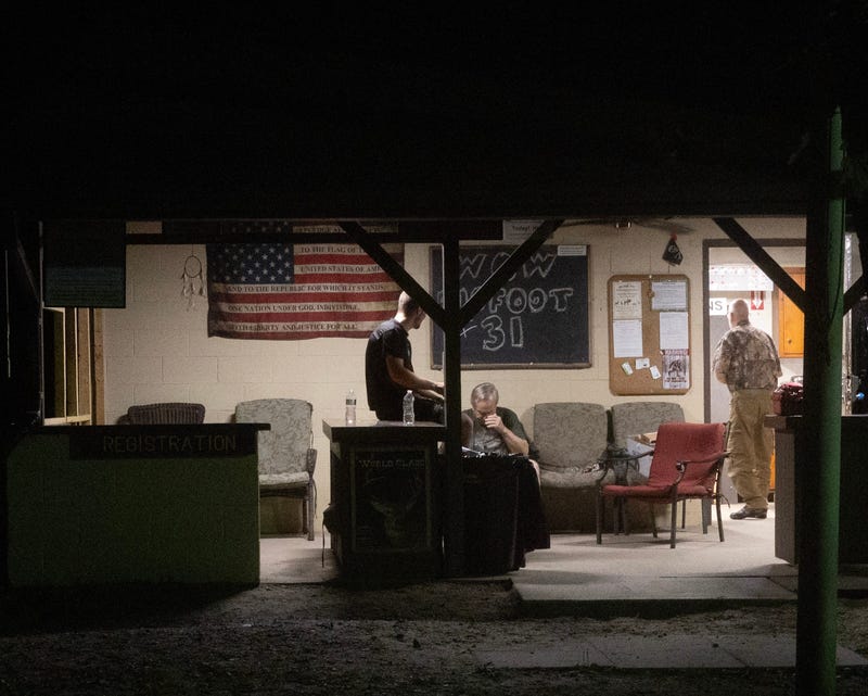 Bow Club members are pictured sitting in a clubhouse. A lightning strike at the Black Knight Bowbenders archery range on Perrineville Road in Jackson, New Jersey, has left one dead and 14 others injured, including children, Wednesday, July 16, 2025