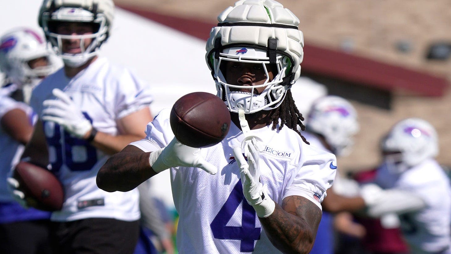 Beane glad Cook is at practice, not holding out