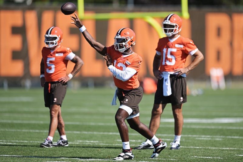 Cleveland Browns quarterback Dillon Gabriel (5) throws a pass as quarterback Joe Flacco (15) land quarterback Dillon Gabriel (5) look on during training camp at CrossCountry Mortgage Campus