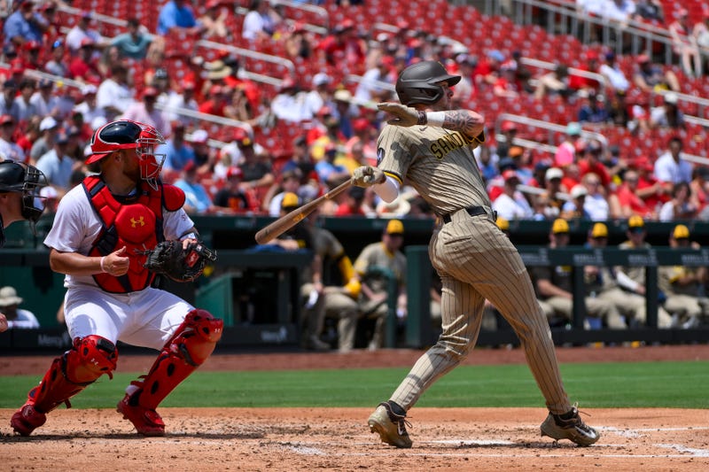 San Diego Padres center fielder Jackson Merrill (3) drives in a run against the St. Louis Cardinals during the third inning at Busch Stadium.