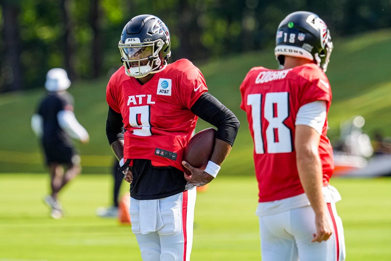 Jul 29, 2025; Atlanta, GA, USA; Atlanta Falcons quarterback Michael Penix Jr. (9) shown next to quarterback Kirk Cousins (18) during practice at training camp at IBM Performance Field. Mandatory Credit: Dale Zanine-Imagn Images