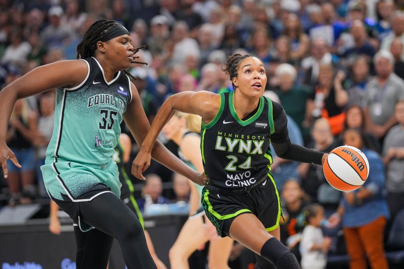 Minnesota Lynx forward Napheesa Collier (24) dribbles against New York Liberty center Jonquel Jones (35) in the first quarter at Target Center. 