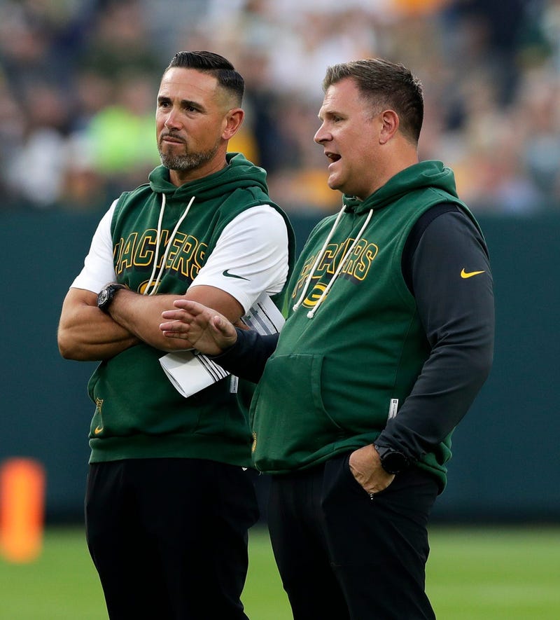 Green Bay Packers Head Coach Matt LaFleur and General Manager Brian Gutekunst talk on the field during Green Bay Packers Family Night on Aug. 2, 2025, at Lambeau Field in Green Bay, Wis.